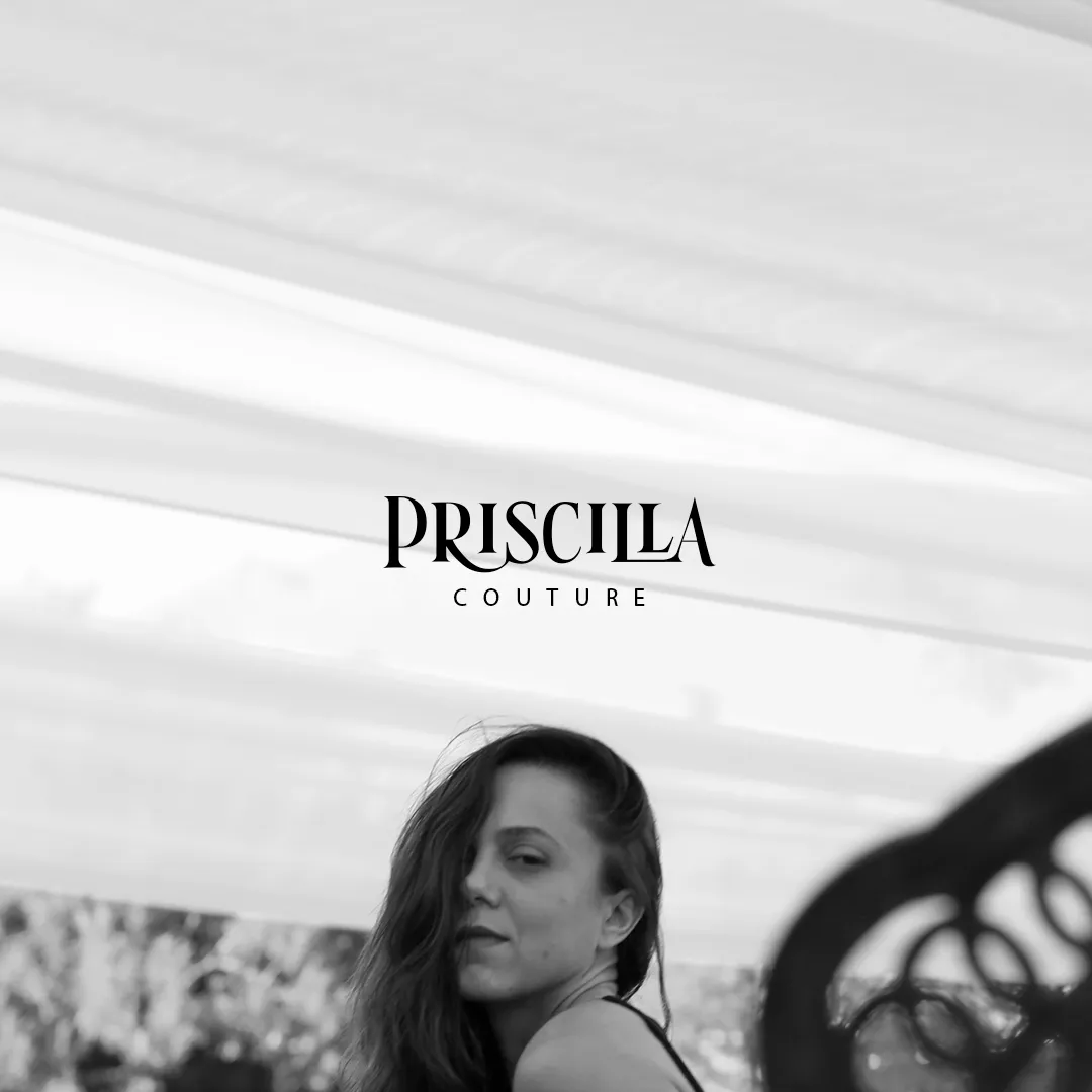 Black and white photo of a woman with long hair looking over her shoulder under a canopy structure, with the Priscilla Couture logo above her.